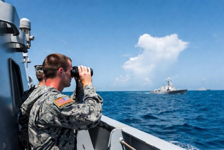 U.S. Navy personnel on patrol duty aboard a warship in the Strait of Hormuz.
